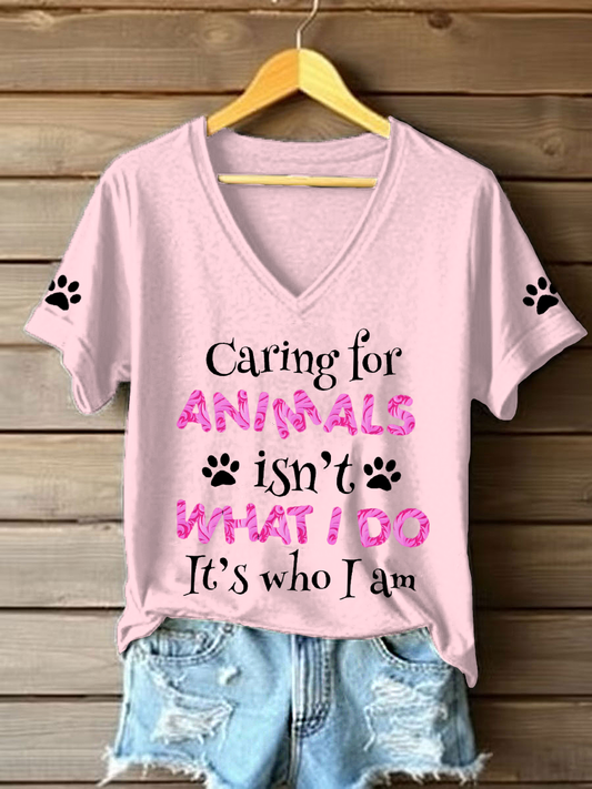 Women's caring for animals isn't what I do it's who I am V-neck T-shirts