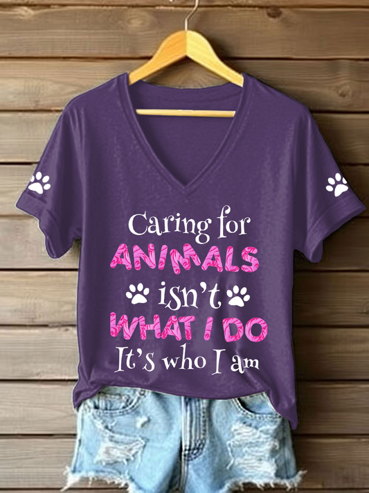 Women's caring for animals isn't what I do it's who I am V-neck T-shirts
